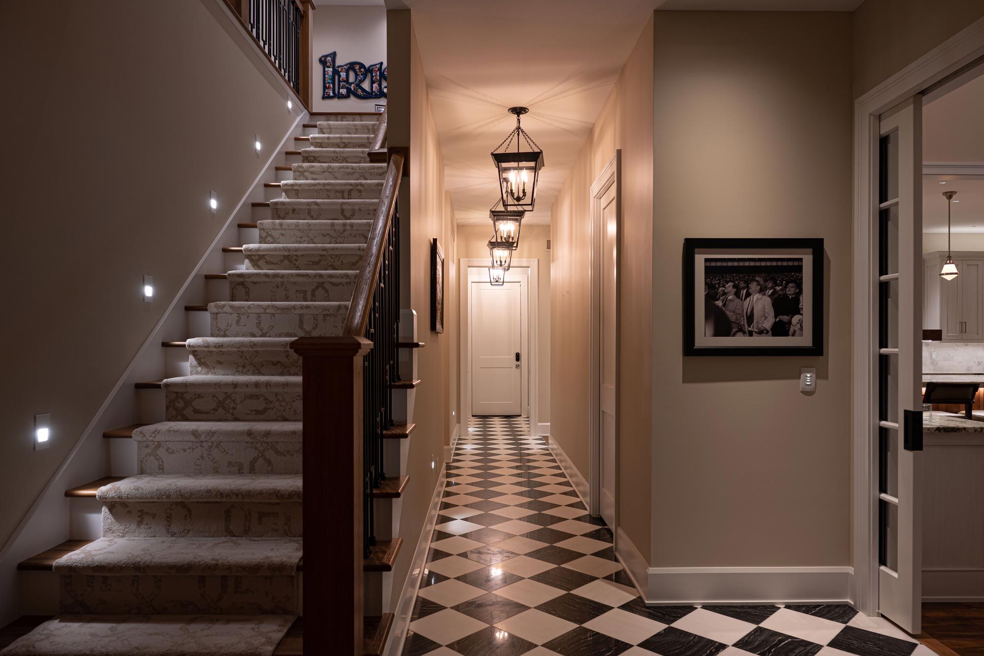 Hallway and staircase with path lighting.